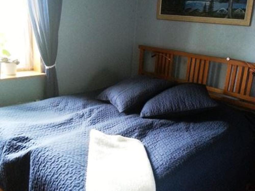 Double bed close to window.